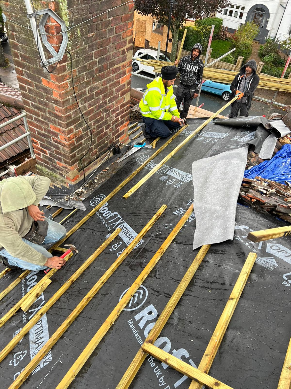 Professional roofers working on a property in London - KS Roof Master