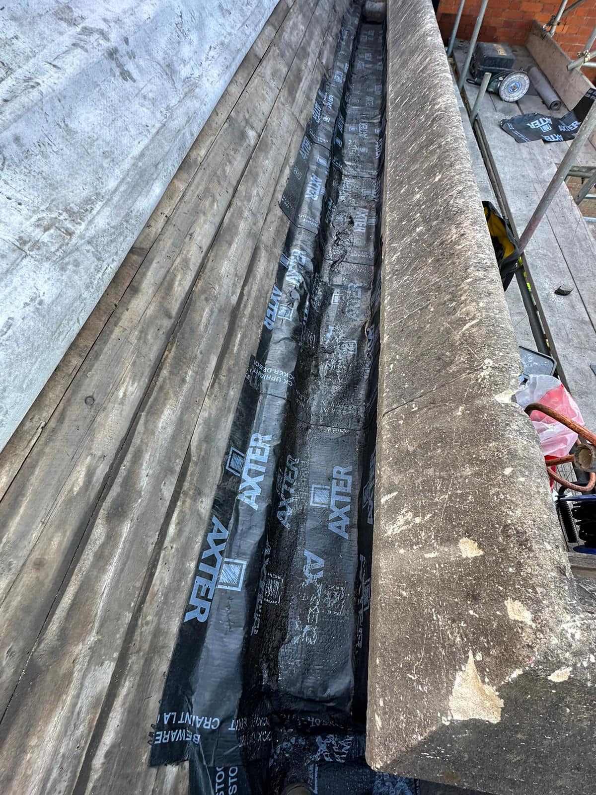 Professional roofers working on a property in London - KS Roof Master