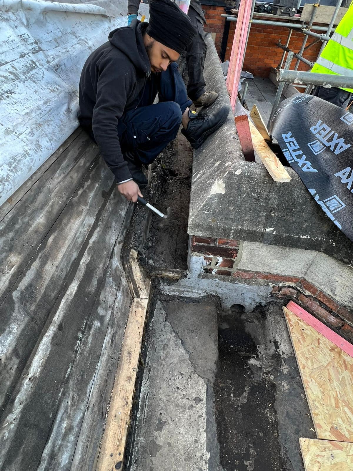 Professional roofers working on a property in London - KS Roof Master