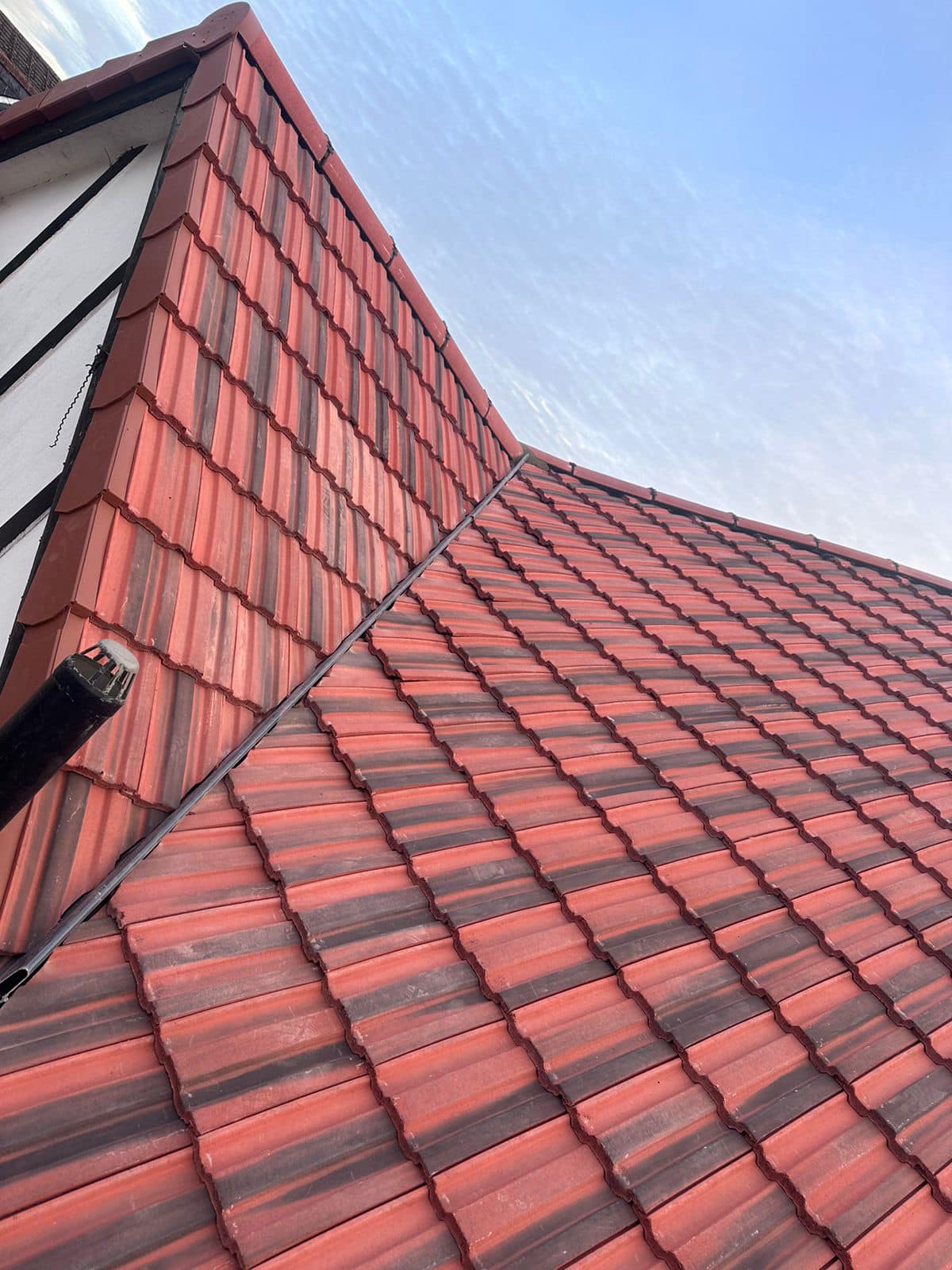 Professional roofers working on a property in London - KS Roof Master