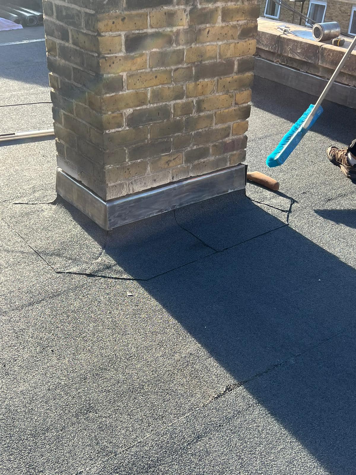 Professional roofers working on a property in London - KS Roof Master