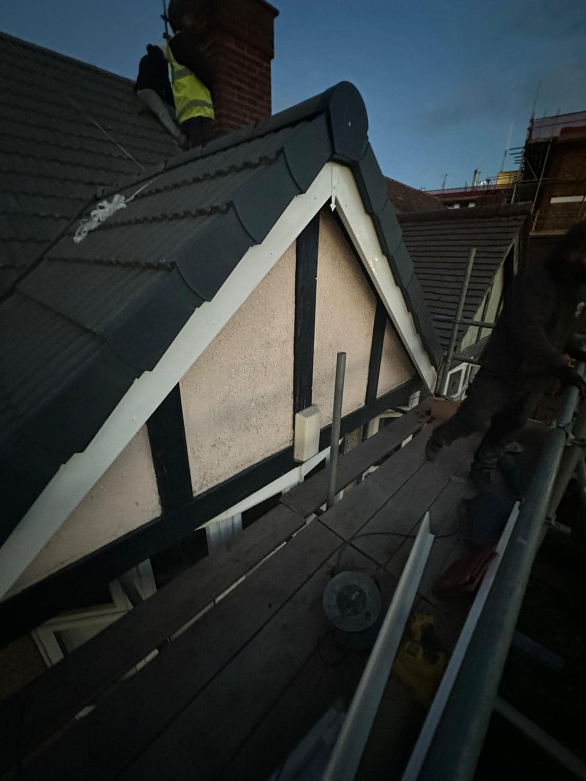 Professional roofers working on a property in London - KS Roof Master