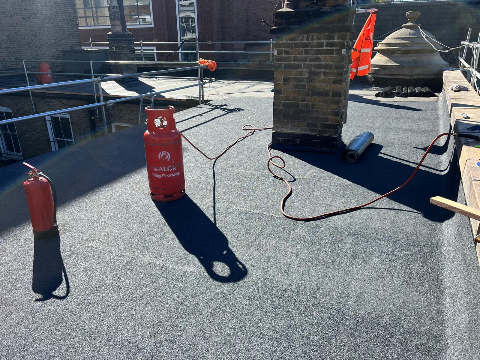 Professional roofers working on a property in London - KS Roof Master