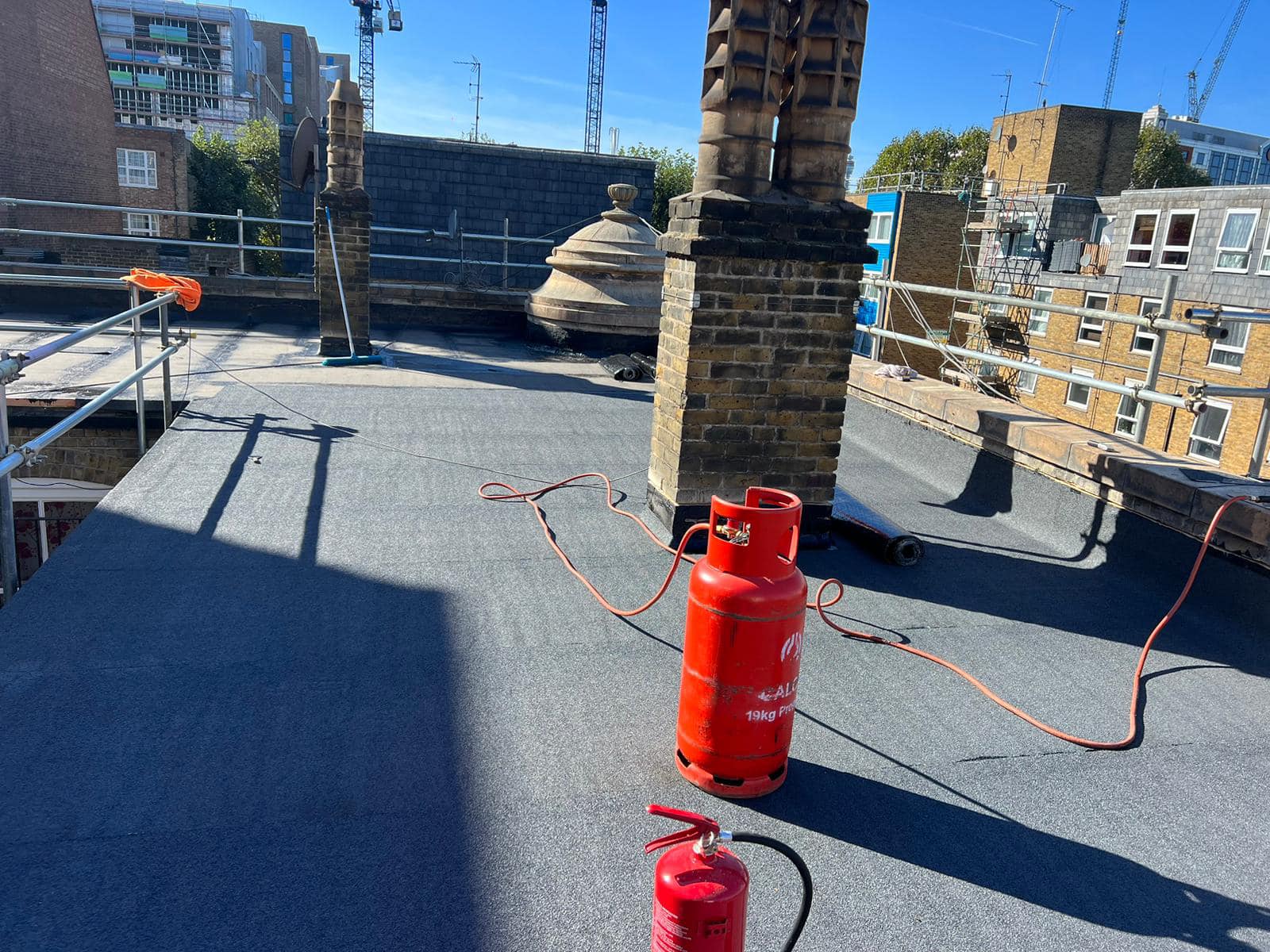 Professional roofers working on a property in London - KS Roof Master