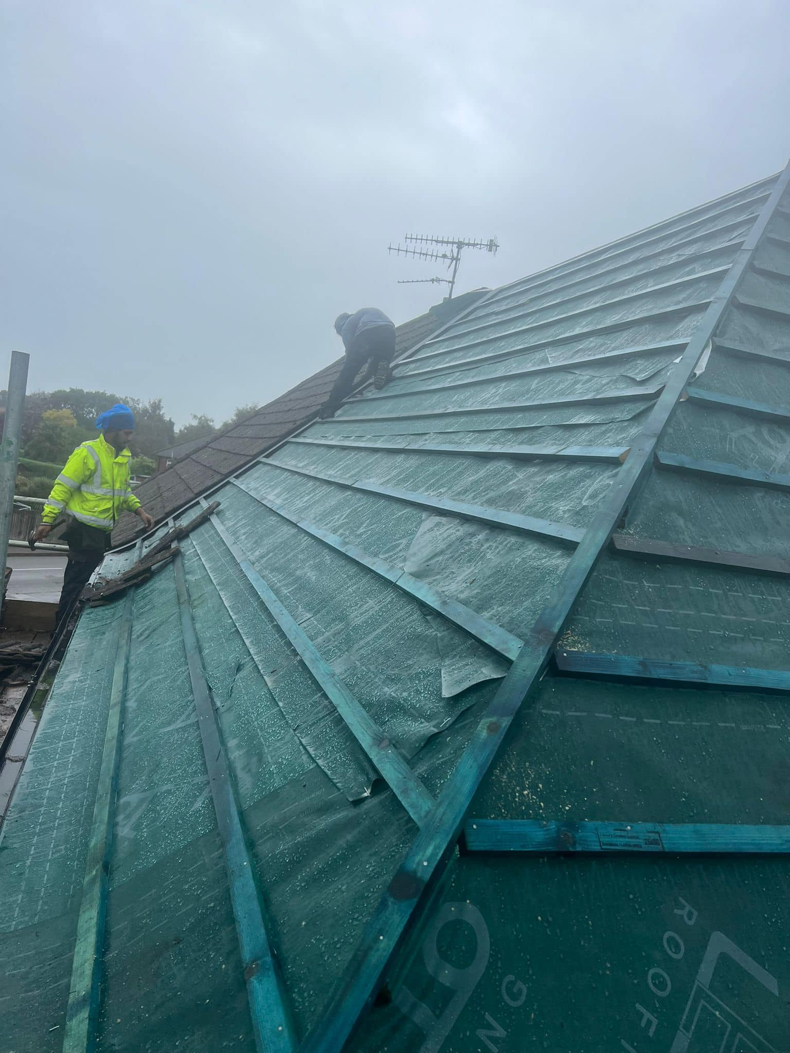 Professional roofers working on a property in London - KS Roof Master