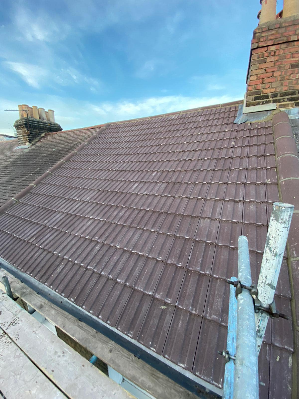 Professional roofers working on a property in London - KS Roof Master