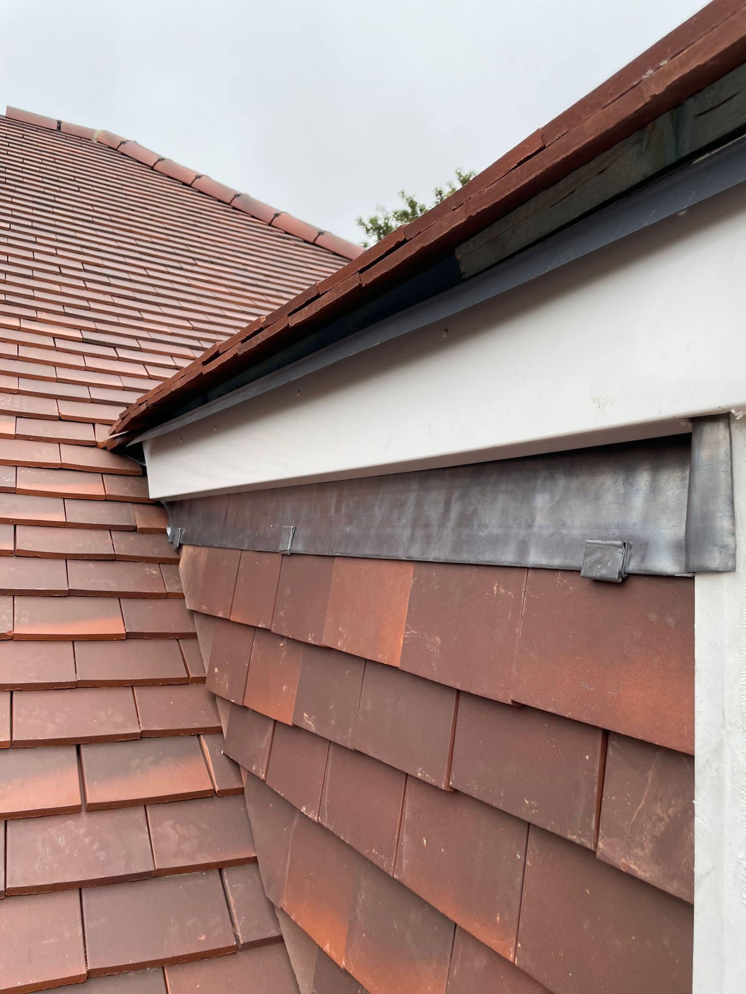 Professional roofers working on a property in London - KS Roof Master