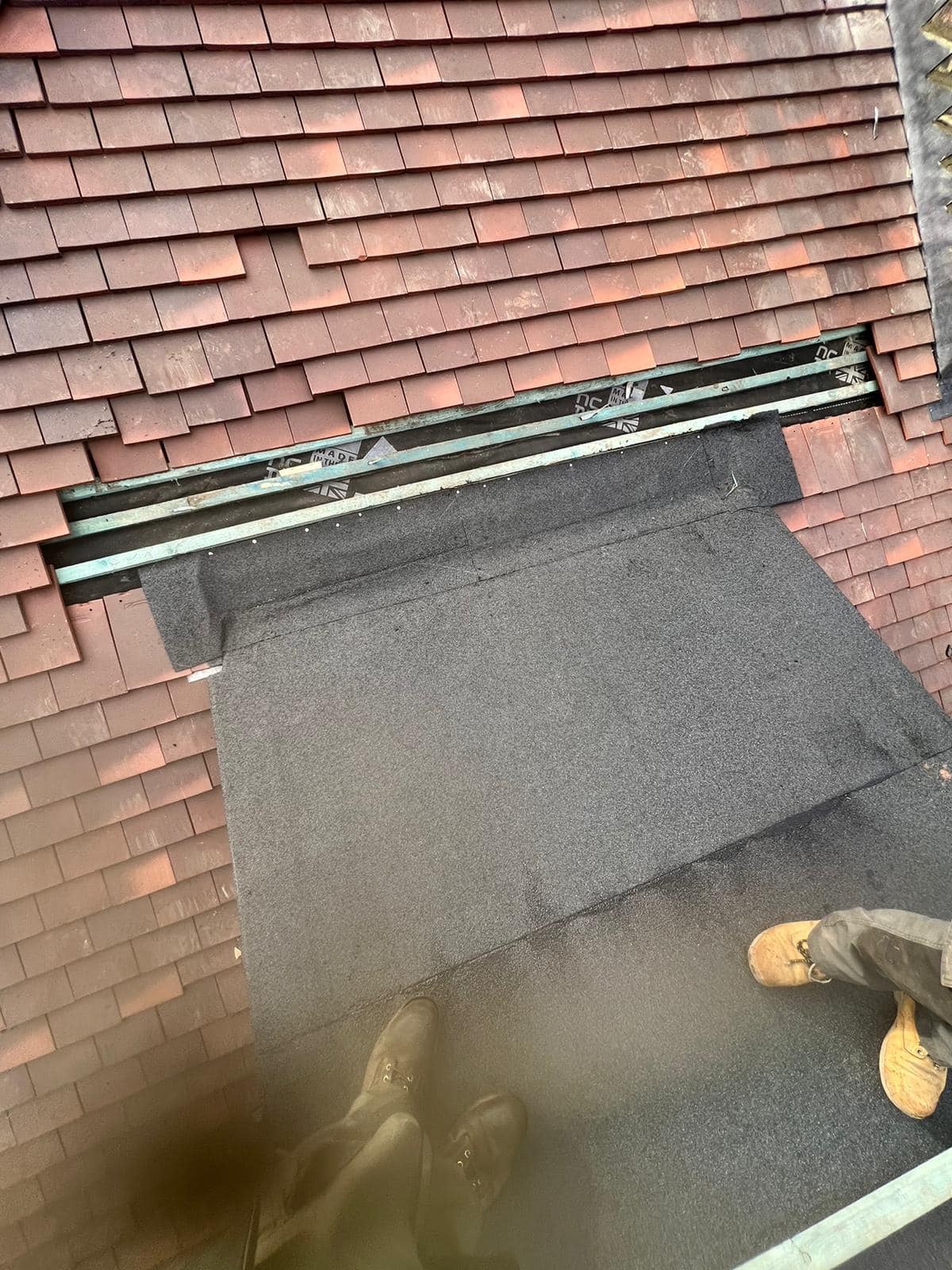 Professional roofers working on a property in London - KS Roof Master