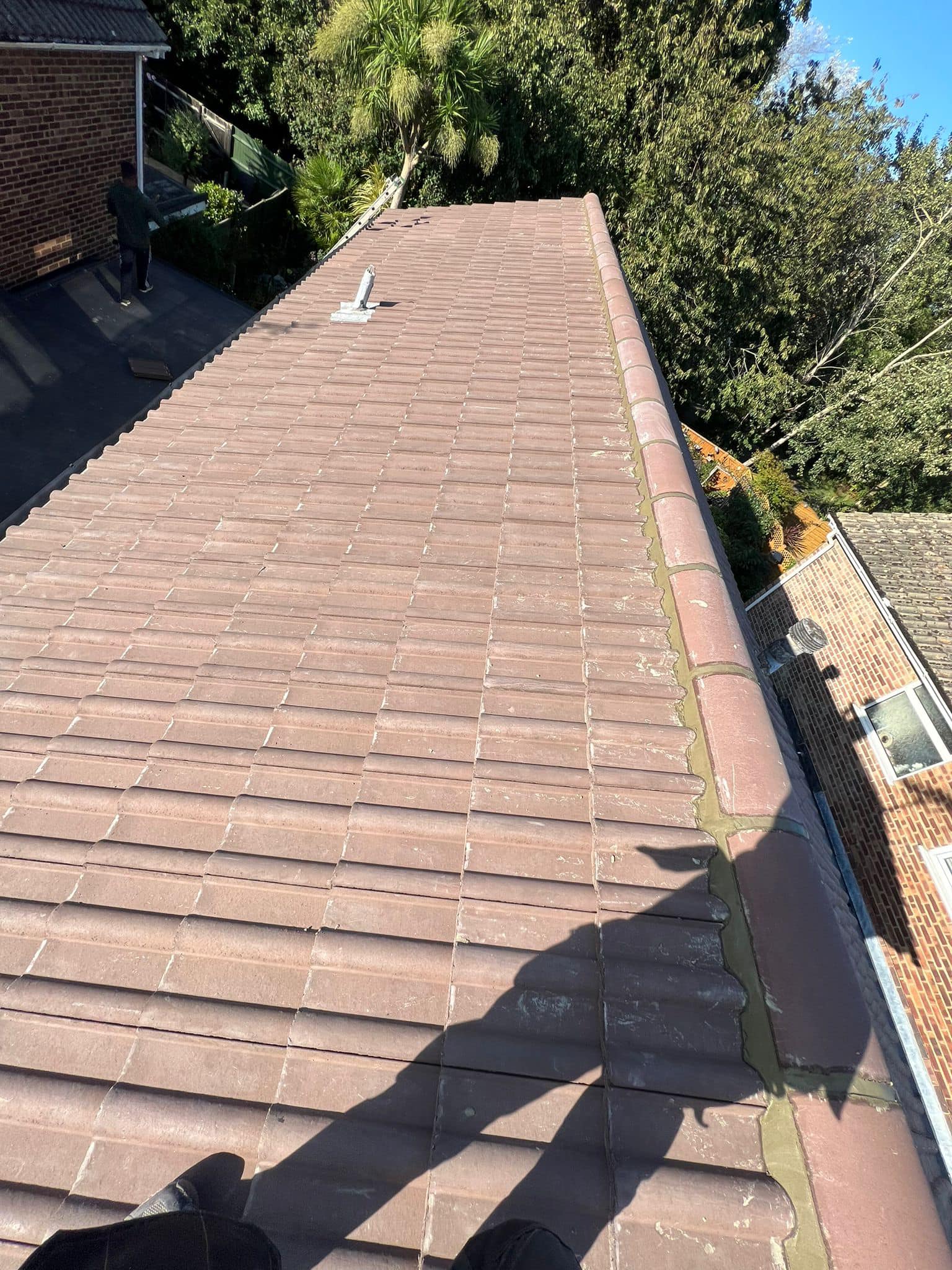 Professional roofers working on a property in London - KS Roof Master