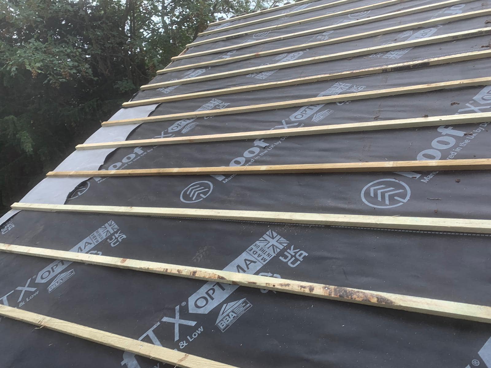 Professional roofers working on a property in London - KS Roof Master