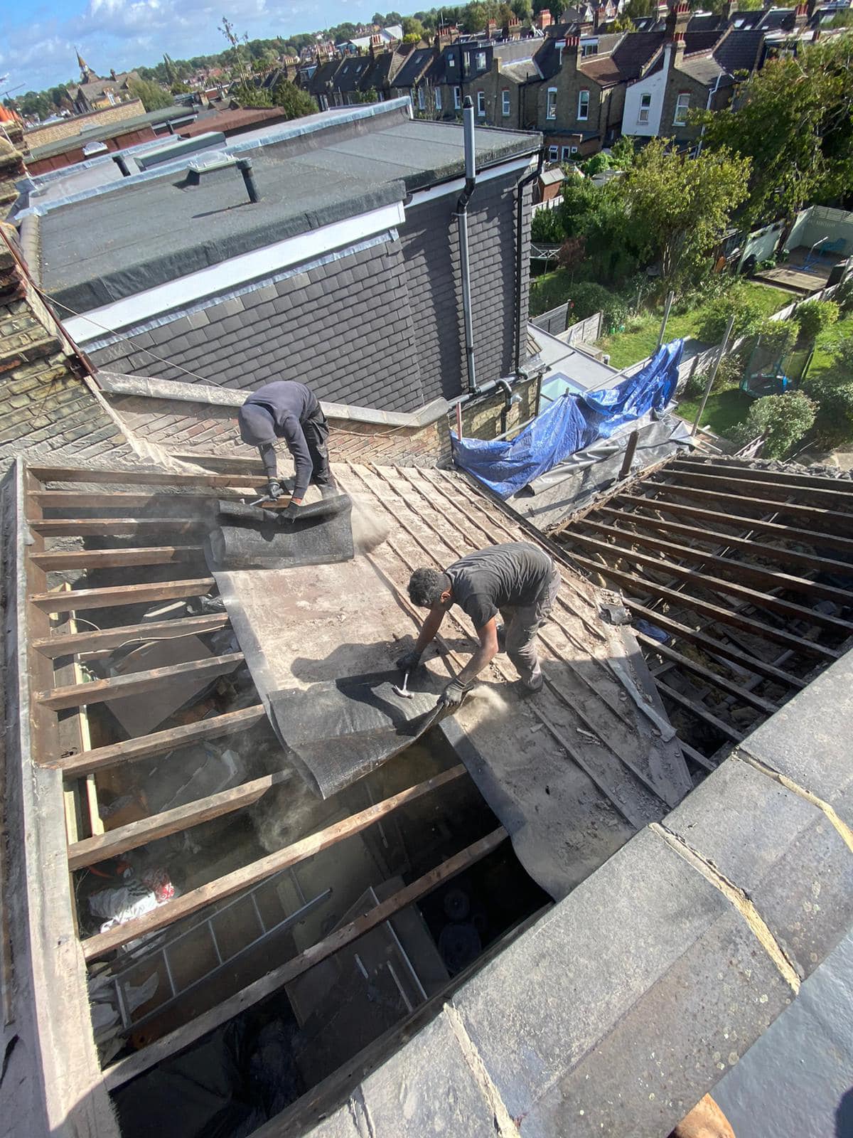 Professional roofers working on a property in London - KS Roof Master
