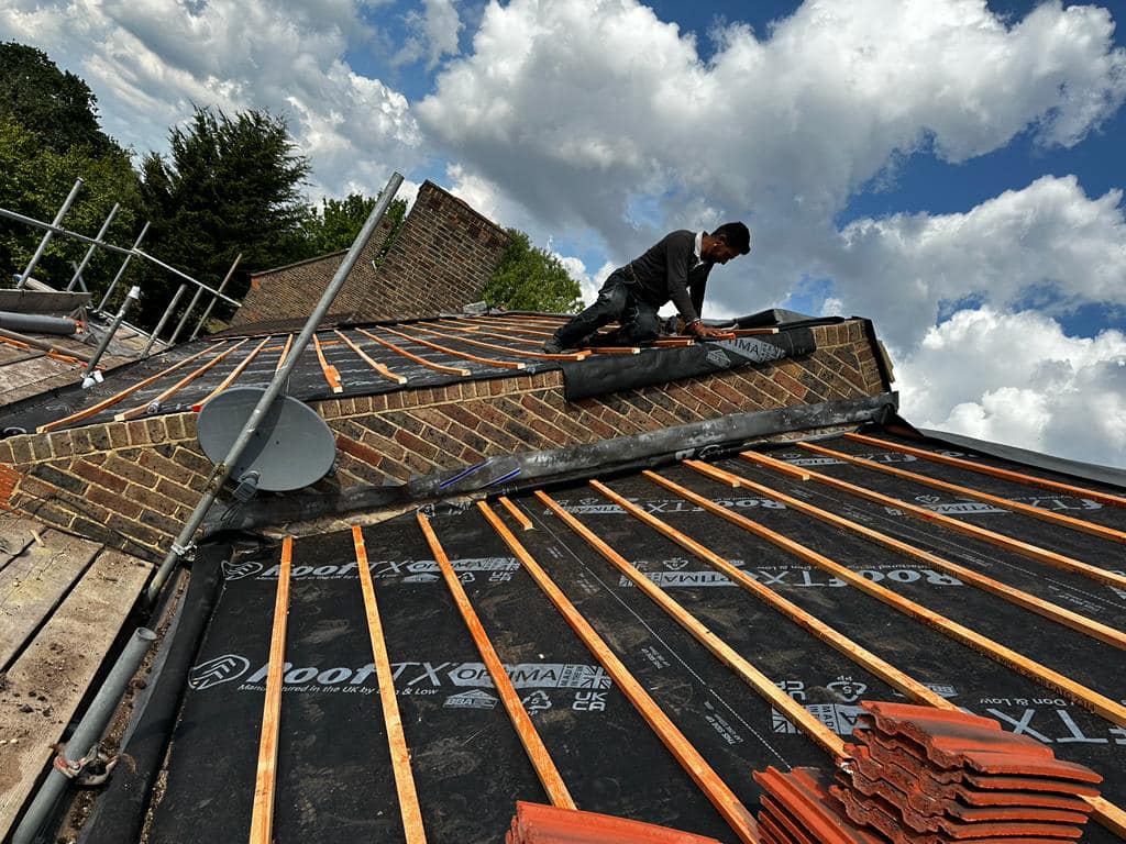 Professional roofers working on a property in London - KS Roof Master