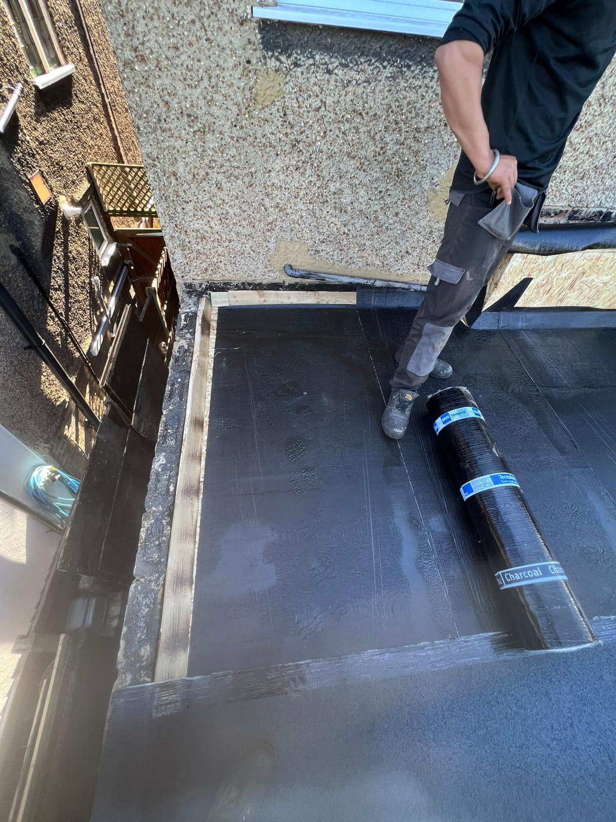 Professional roofers working on a property in London - KS Roof Master