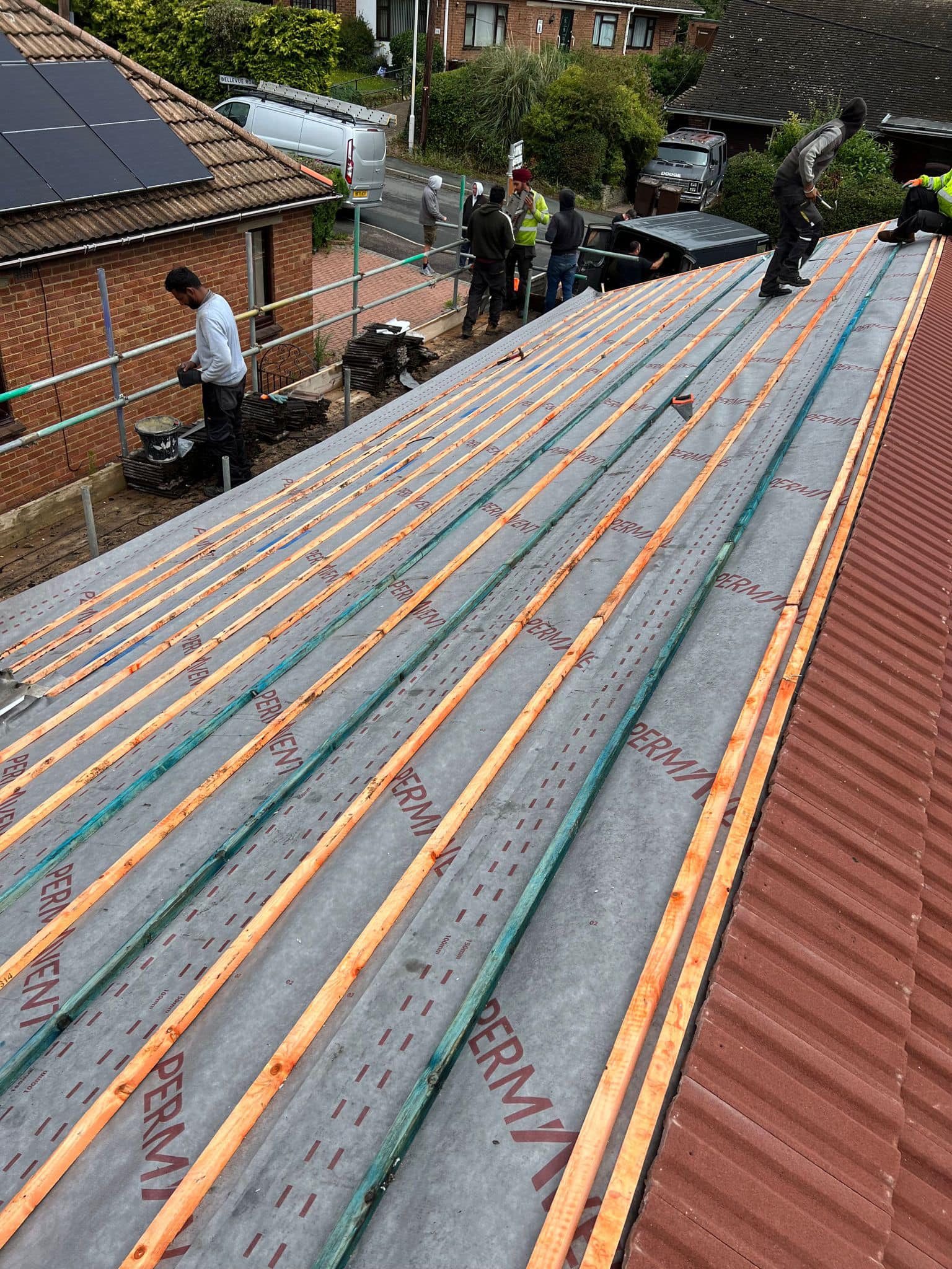 Professional roofers working on a property in London - KS Roof Master
