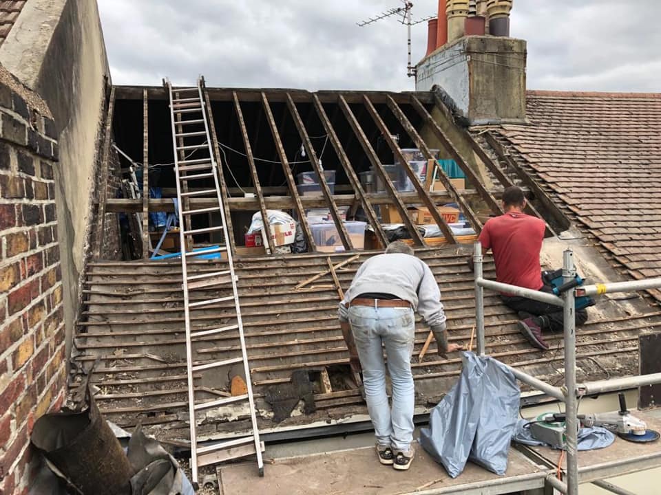 Professional roofers working on a property in London - KS Roof Master