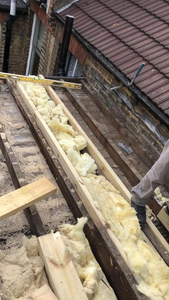 Professional roofers working on a property in London - KS Roof Master