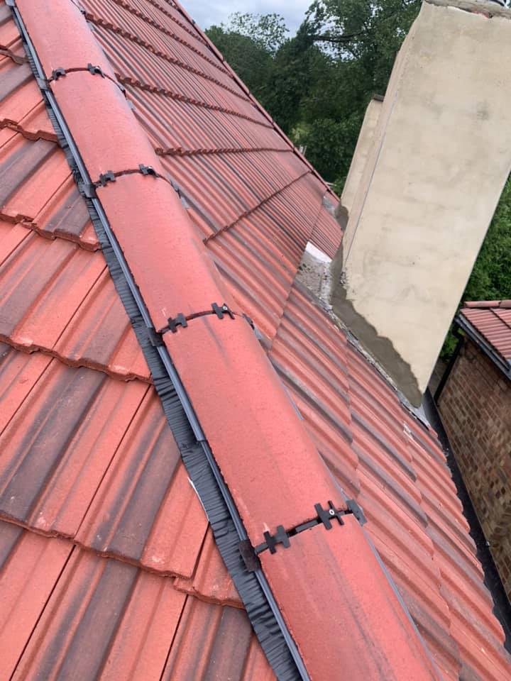 Professional roofers working on a property in London - KS Roof Master