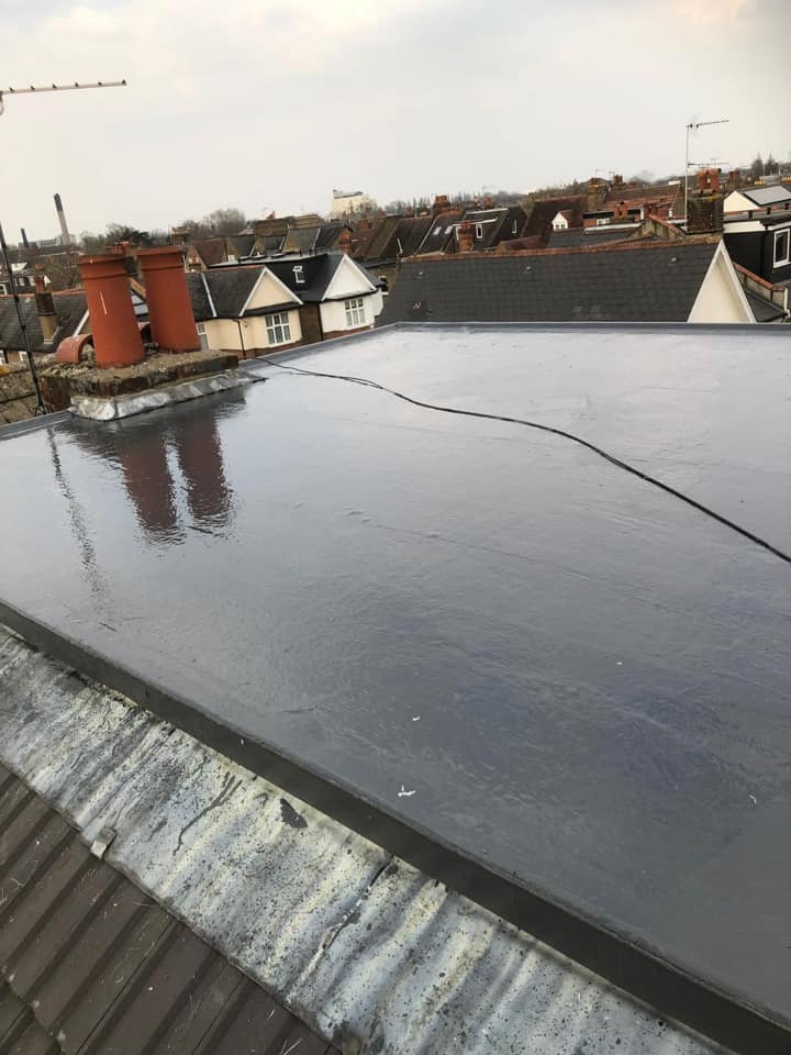 Professional roofers working on a property in London - KS Roof Master