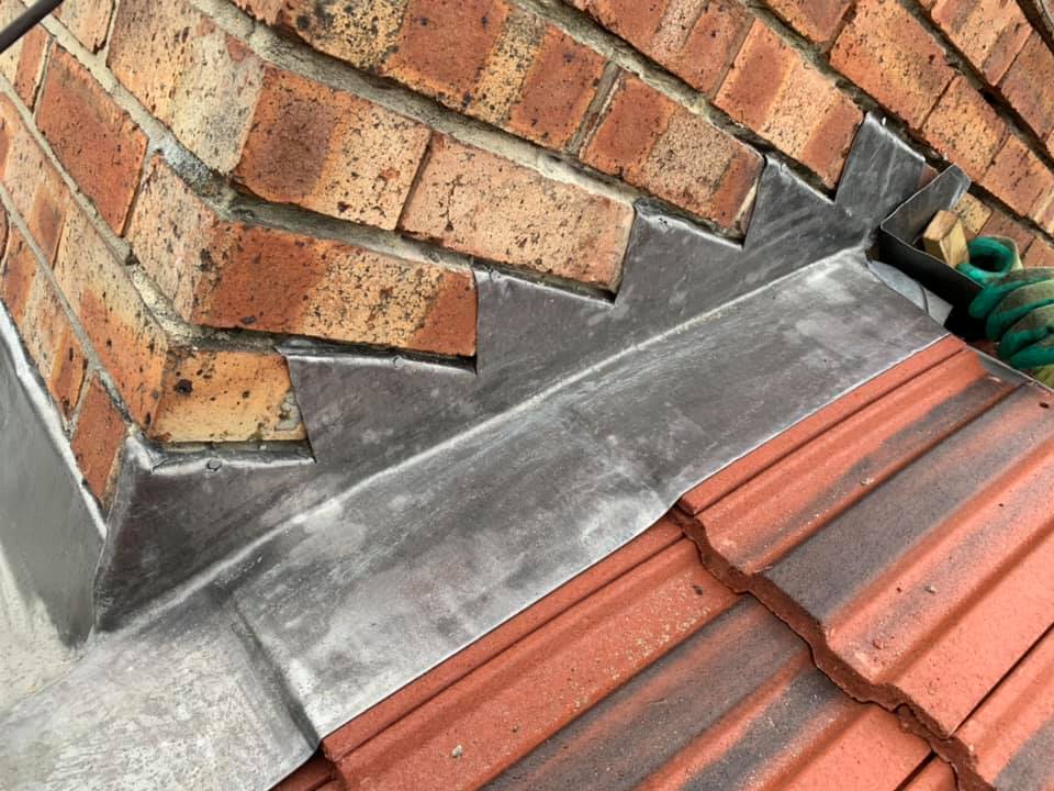 Professional roofers working on a property in London - KS Roof Master