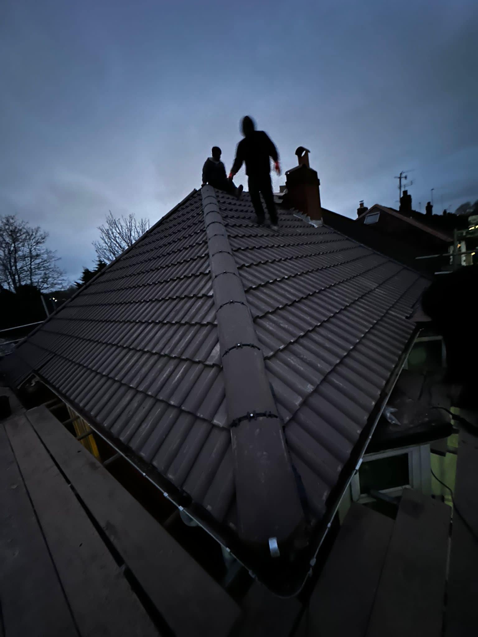 Professional roofers working on a property in London - KS Roof Master