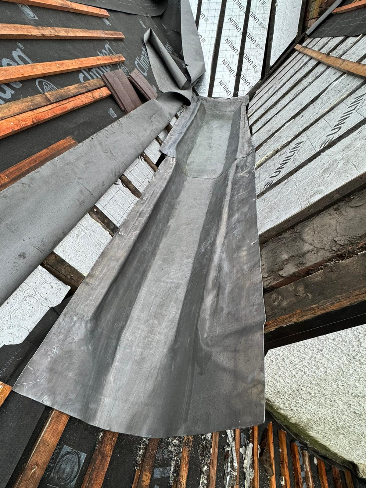 Professional roofers working on a property in London - KS Roof Master