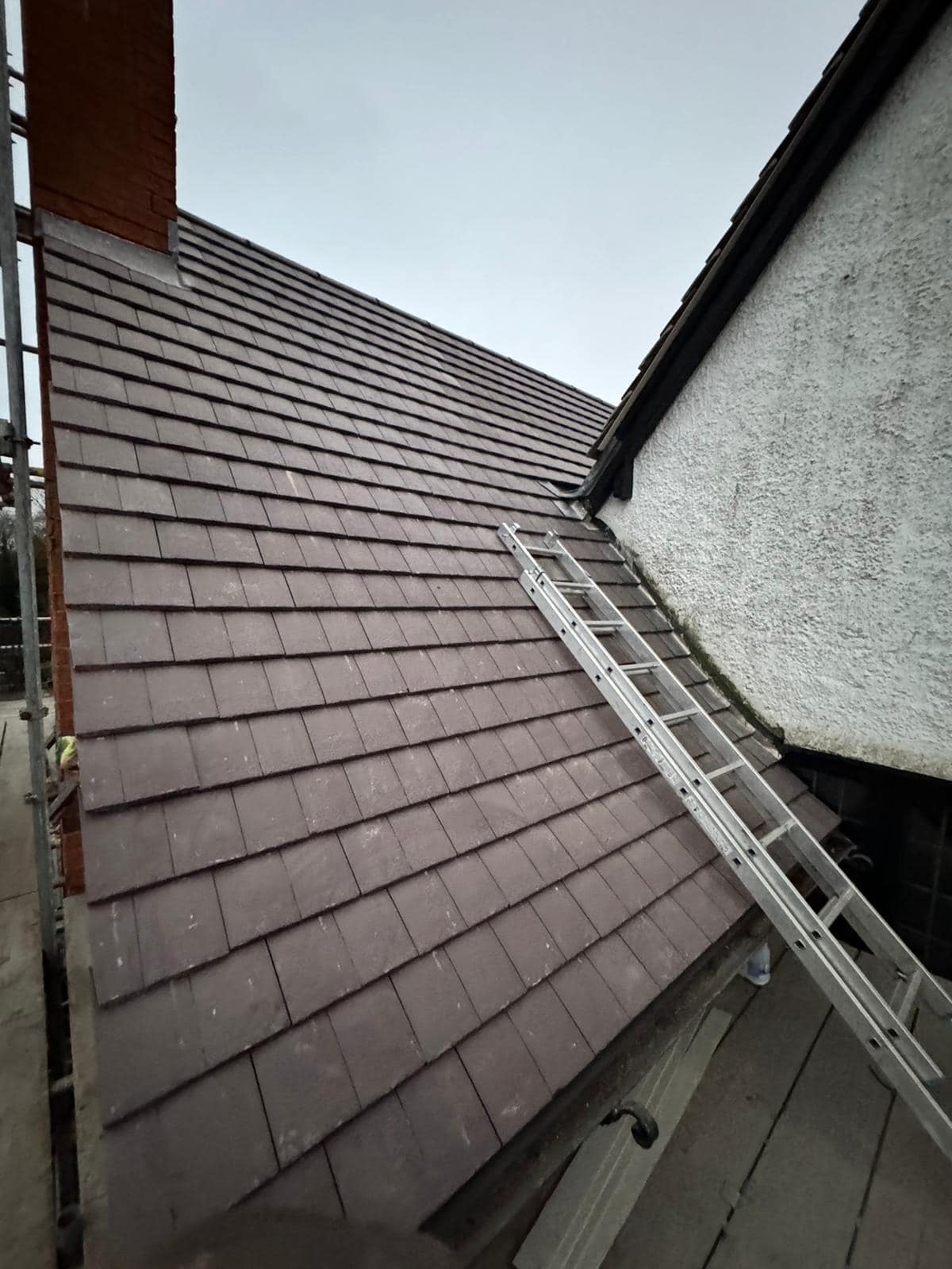 Professional roofers working on a property in London - KS Roof Master