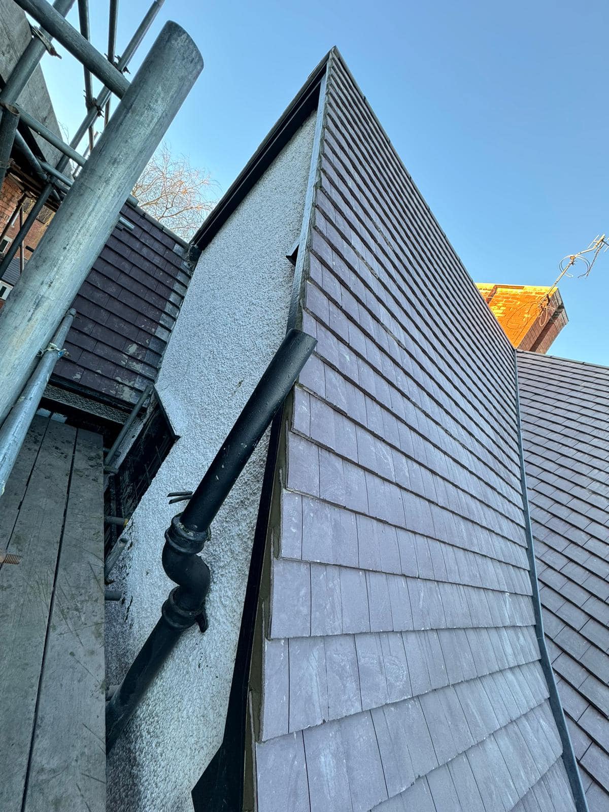 Professional roofers working on a property in London - KS Roof Master