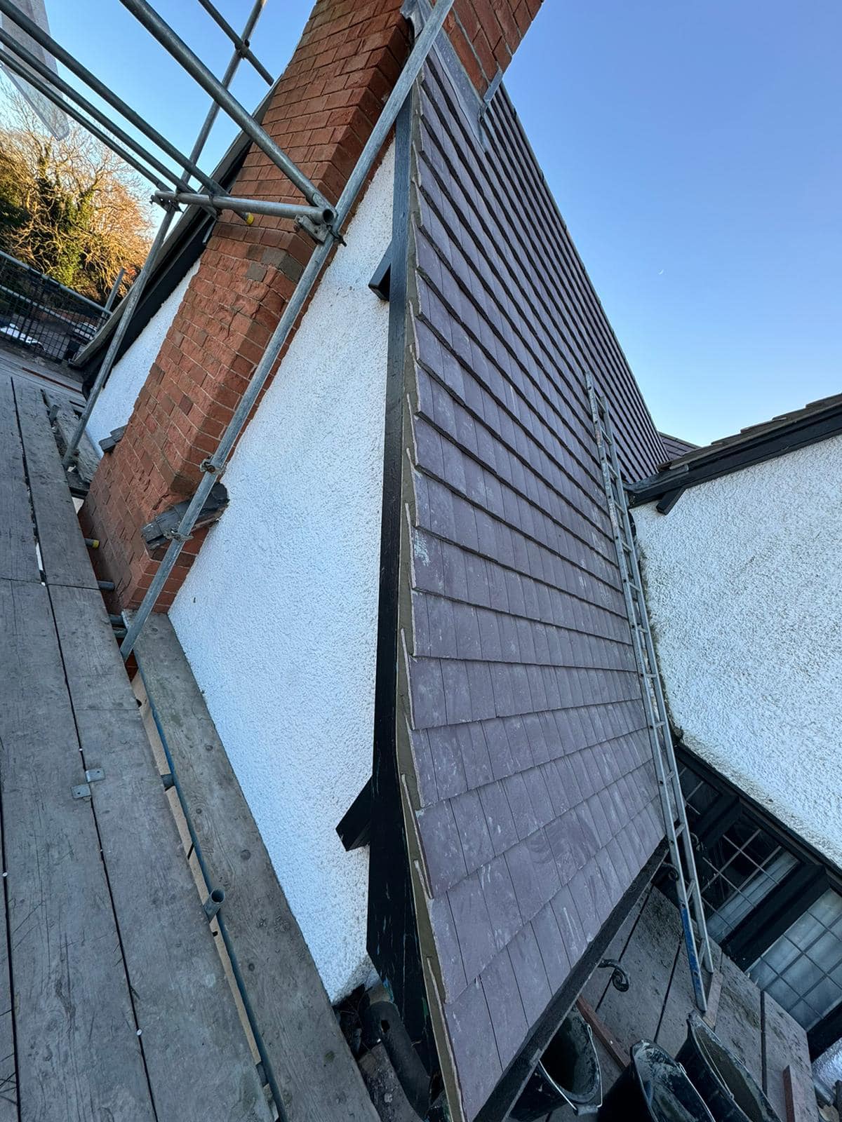 Professional roofers working on a property in London - KS Roof Master