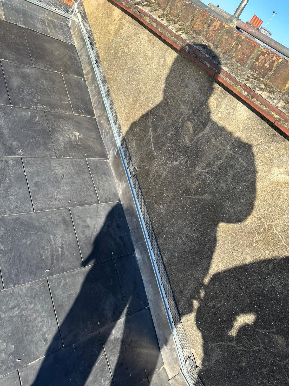 Professional roofers working on a property in London - KS Roof Master