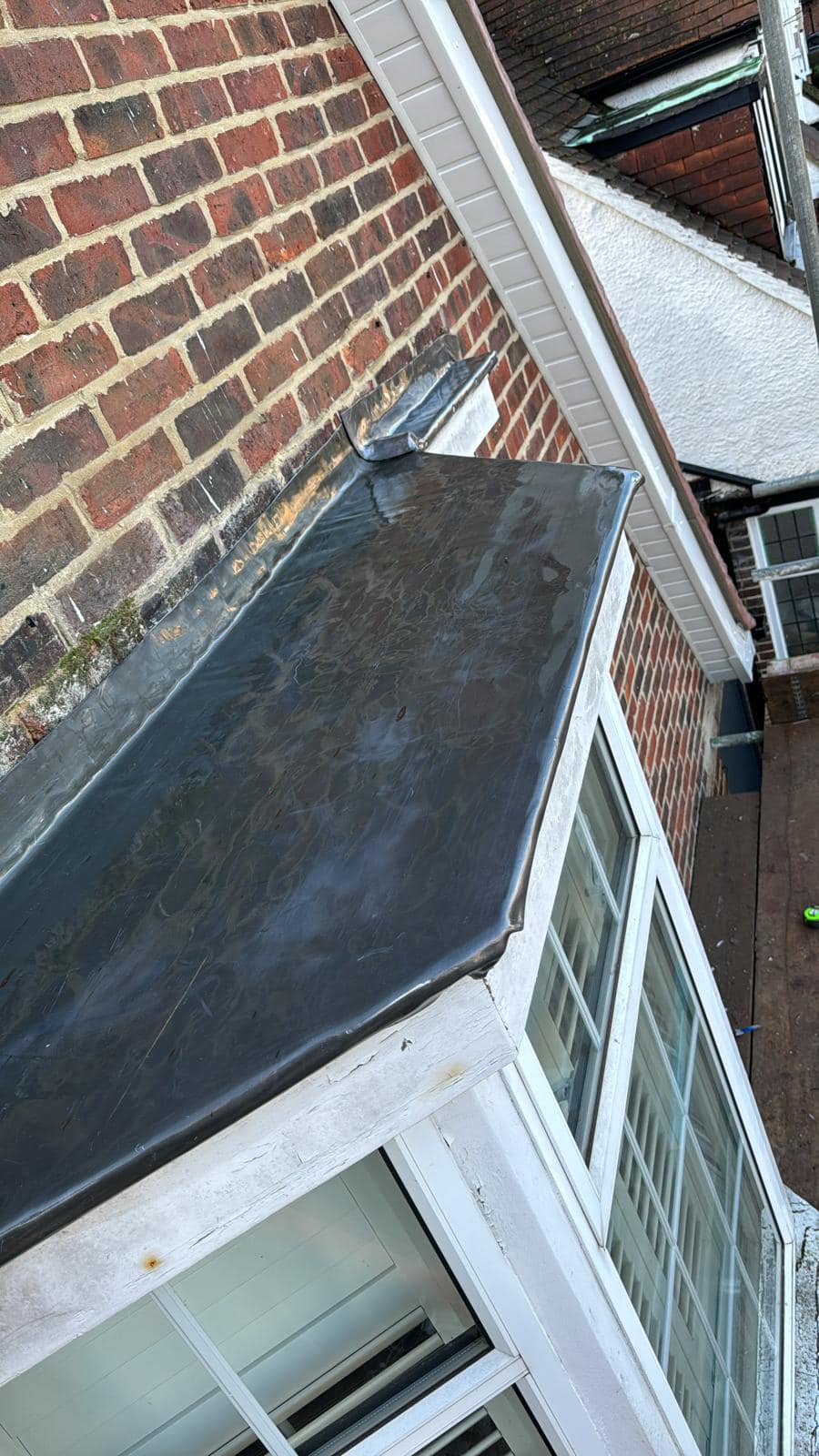 Professional roofers working on a property in London - KS Roof Master