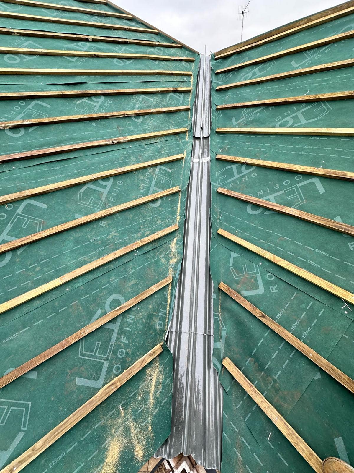 Professional roofers working on a property in London - KS Roof Master