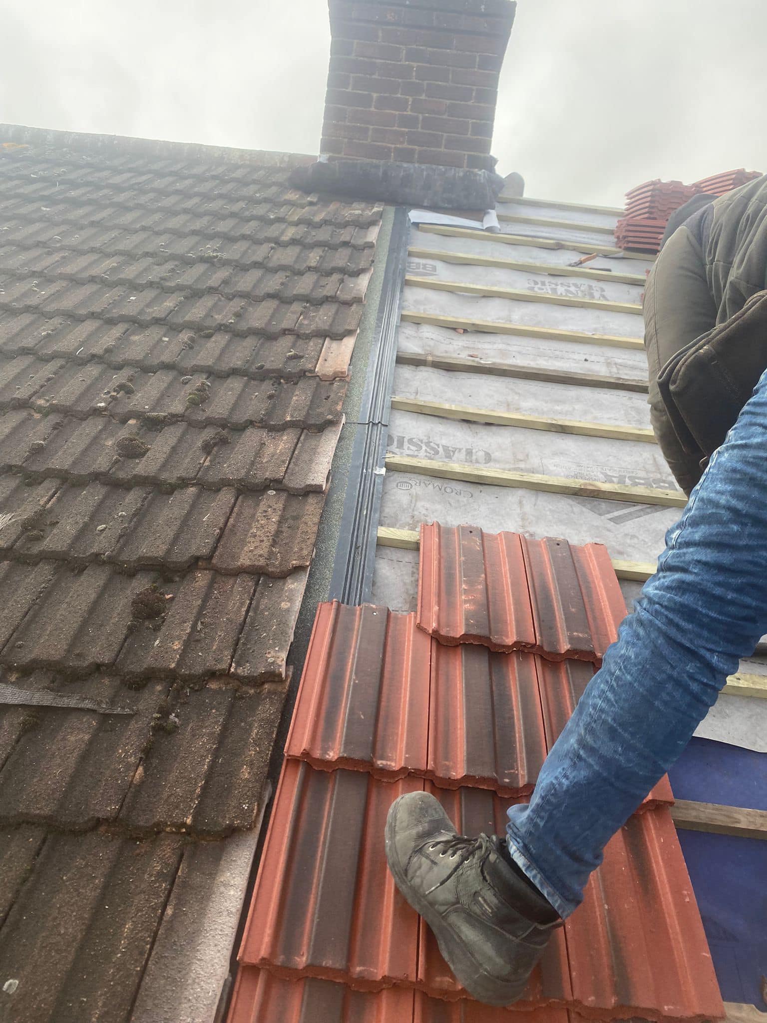 Professional roofers working on a property in London - KS Roof Master