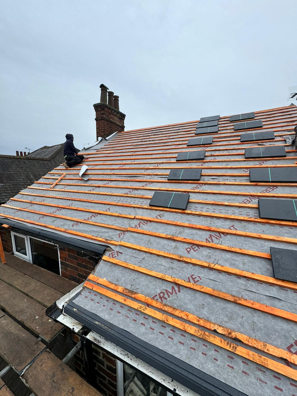 Professional roofers working on a property in London - KS Roof Master