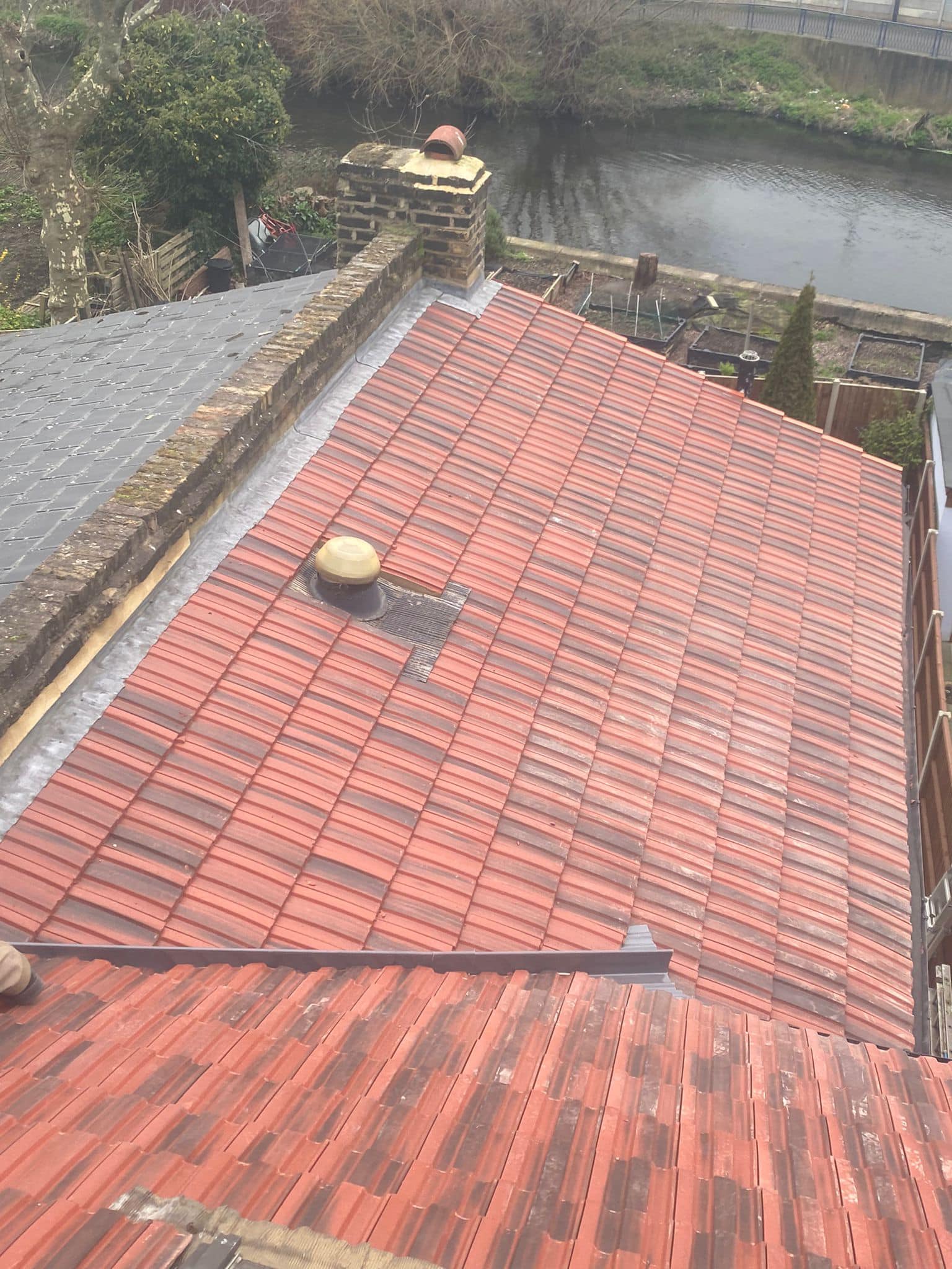 Professional roofers working on a property in London - KS Roof Master