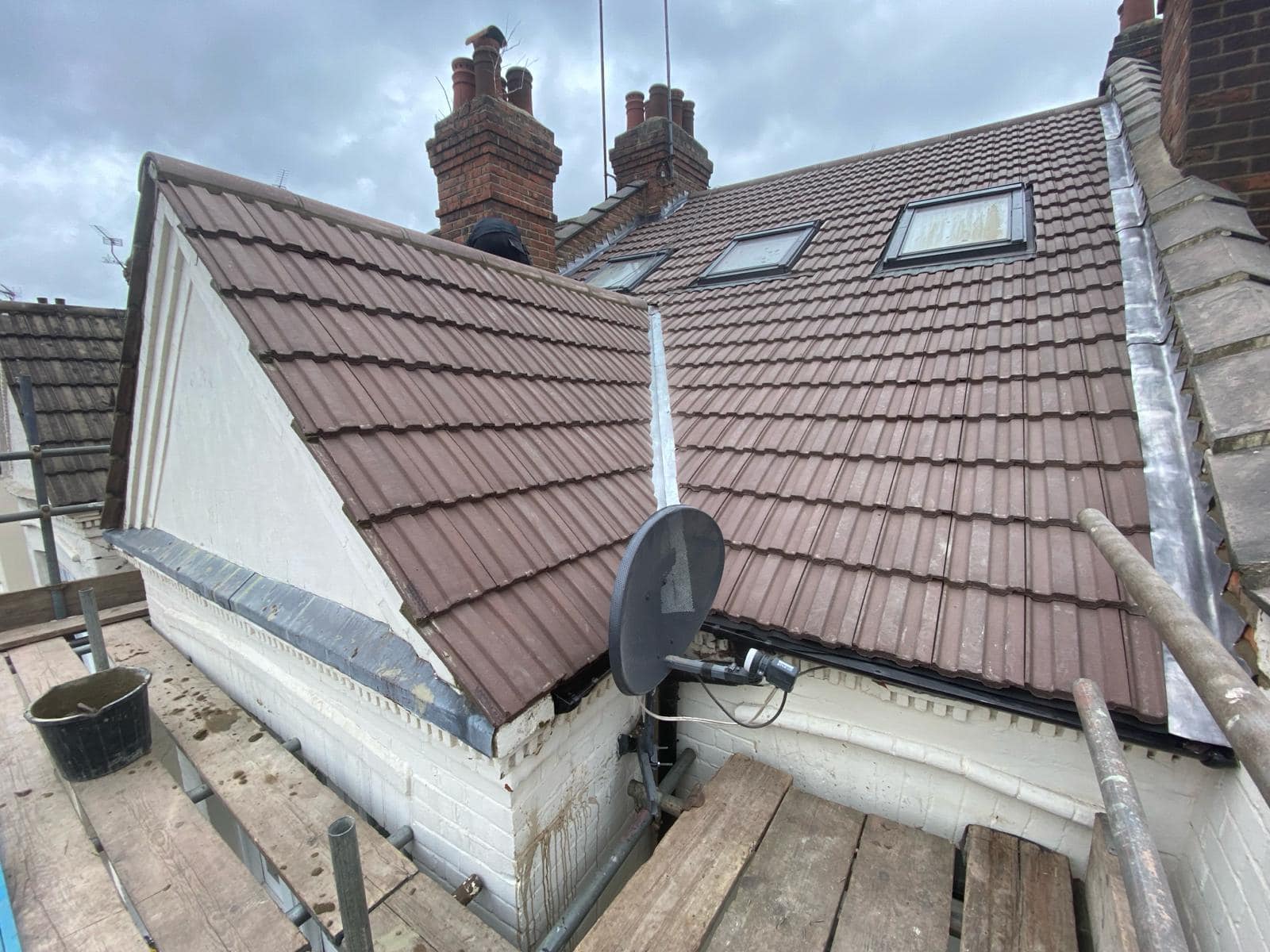 Professional roofers working on a property in London - KS Roof Master