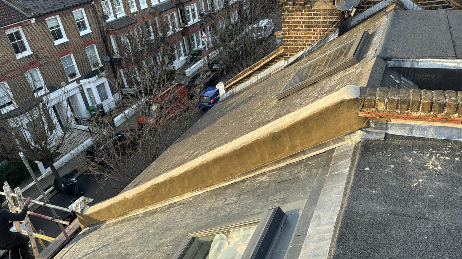 Professional roofers working on a property in London - KS Roof Master