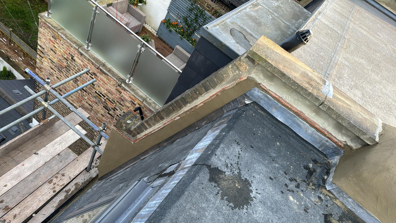Professional roofers working on a property in London - KS Roof Master
