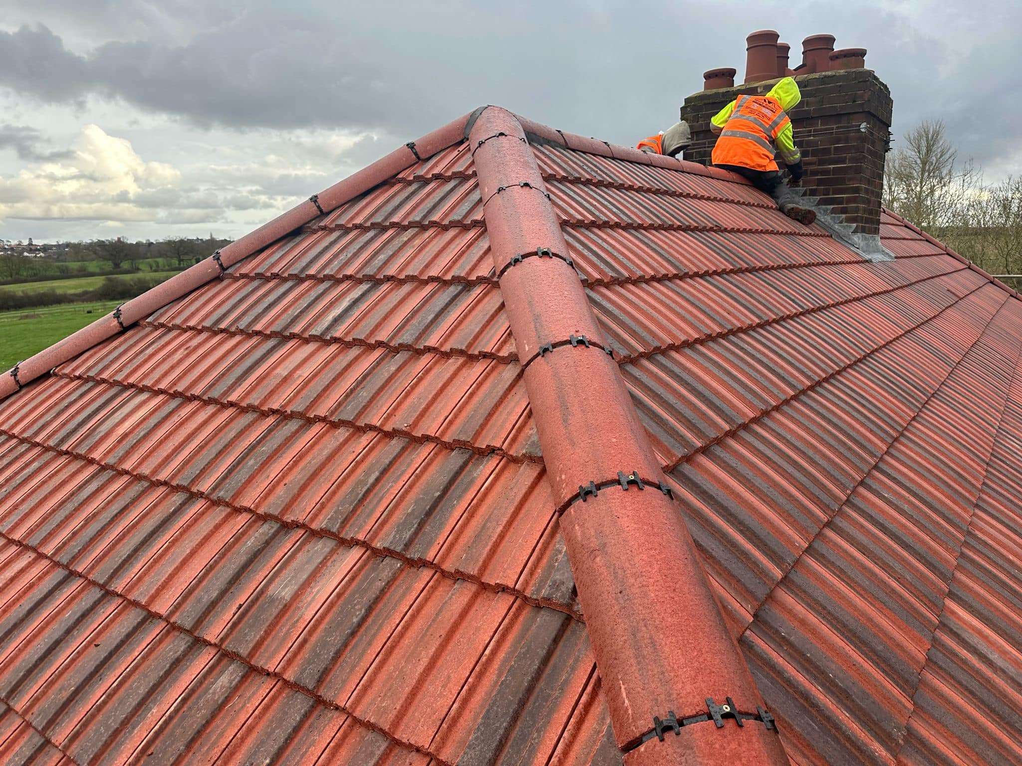 Professional roofers working on a property in London - KS Roof Master