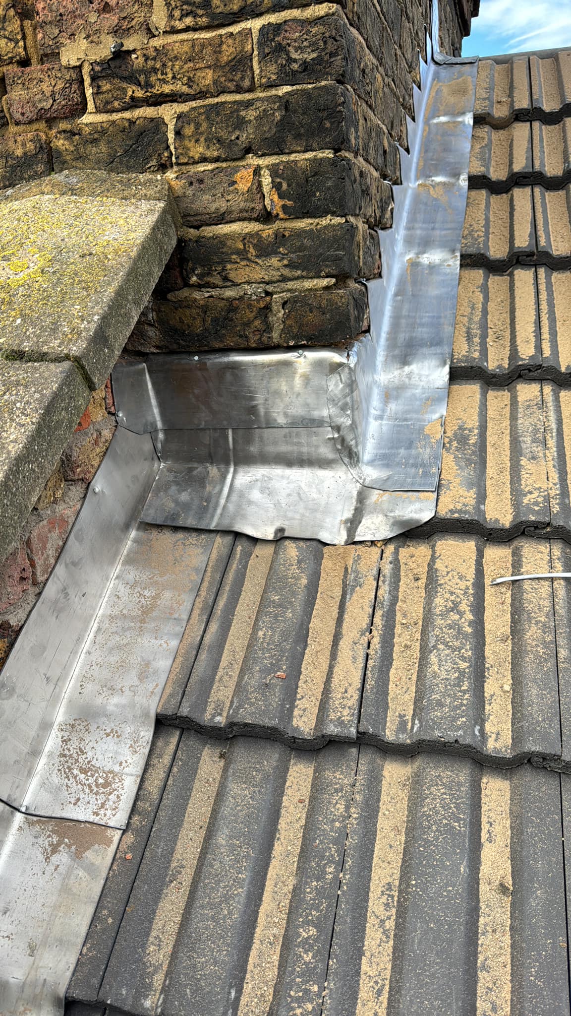 Professional roofers working on a property in London - KS Roof Master