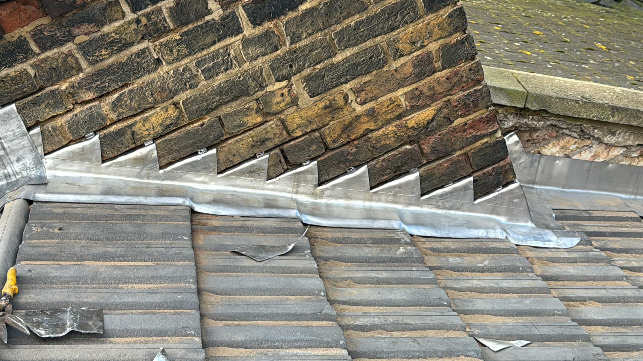Professional roofers working on a property in London - KS Roof Master