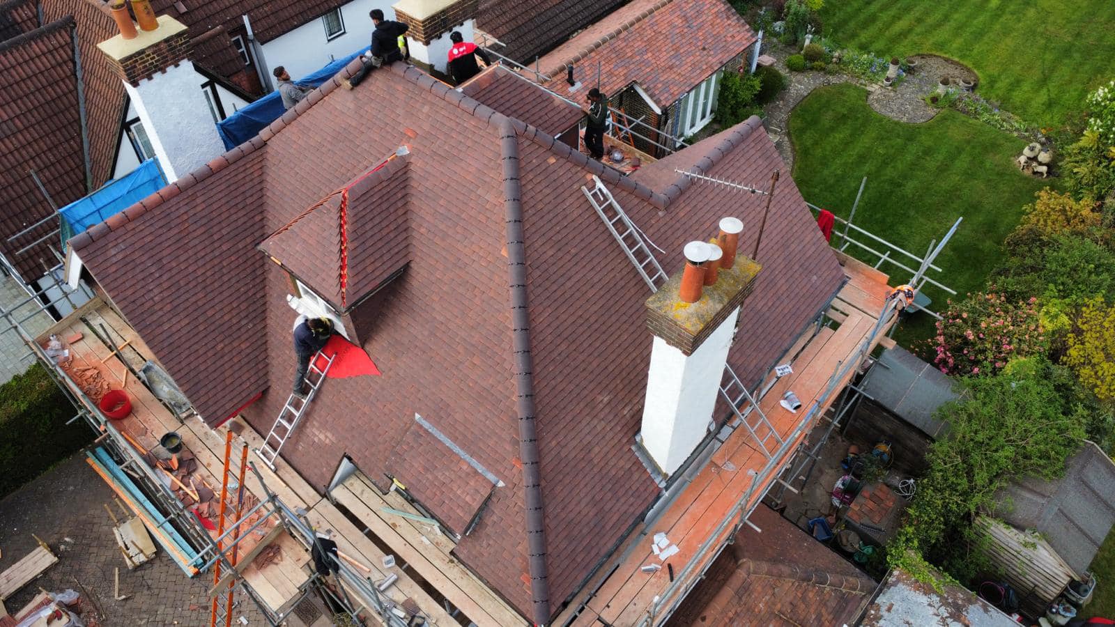 Professional roofers working on a property in London - KS Roof Master