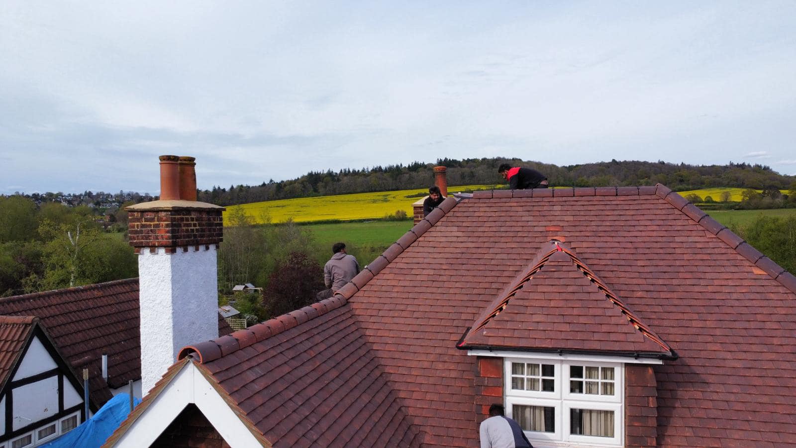 Professional roofers working on a property in London - KS Roof Master