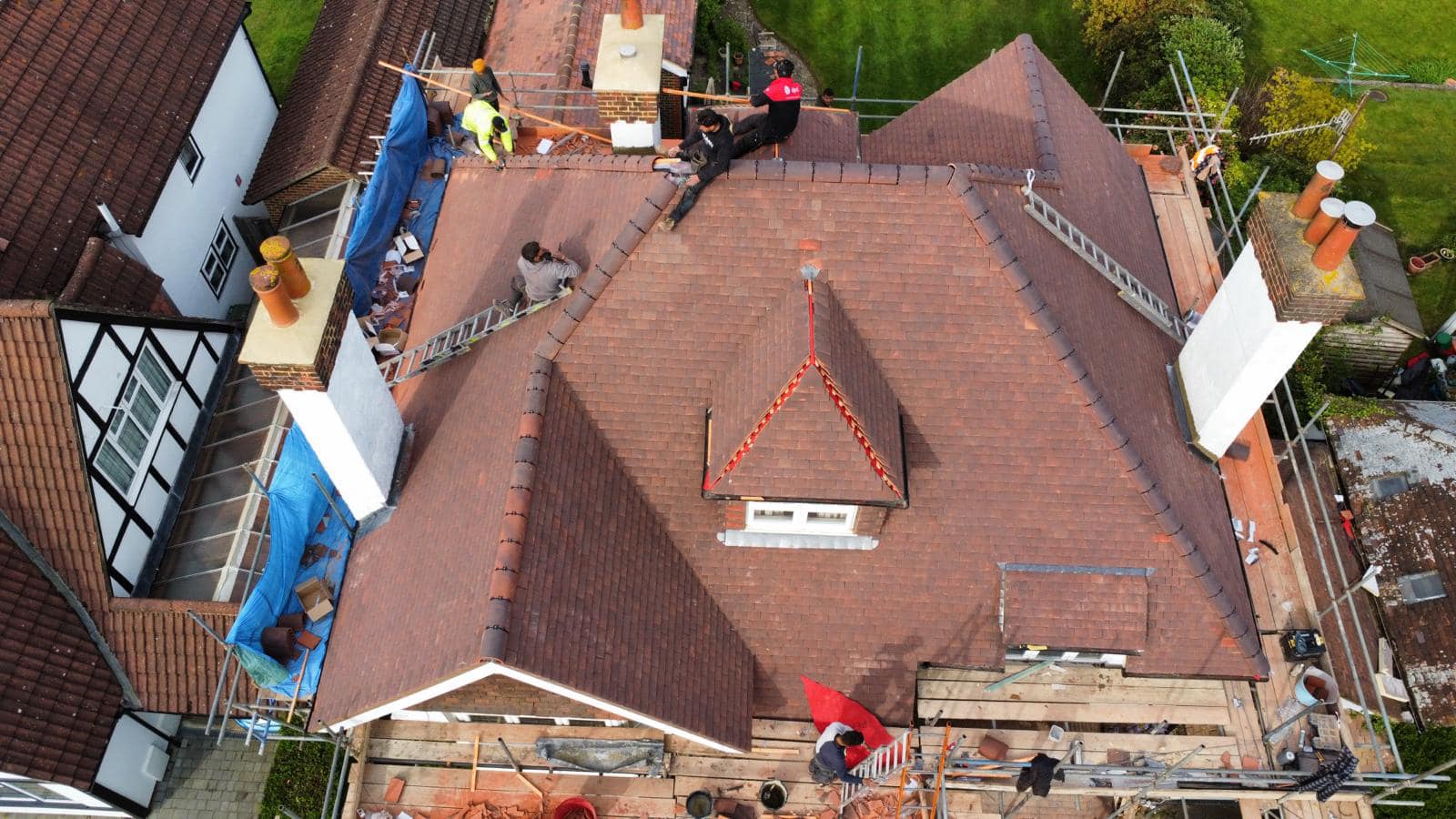 Professional roofers working on a property in London - KS Roof Master