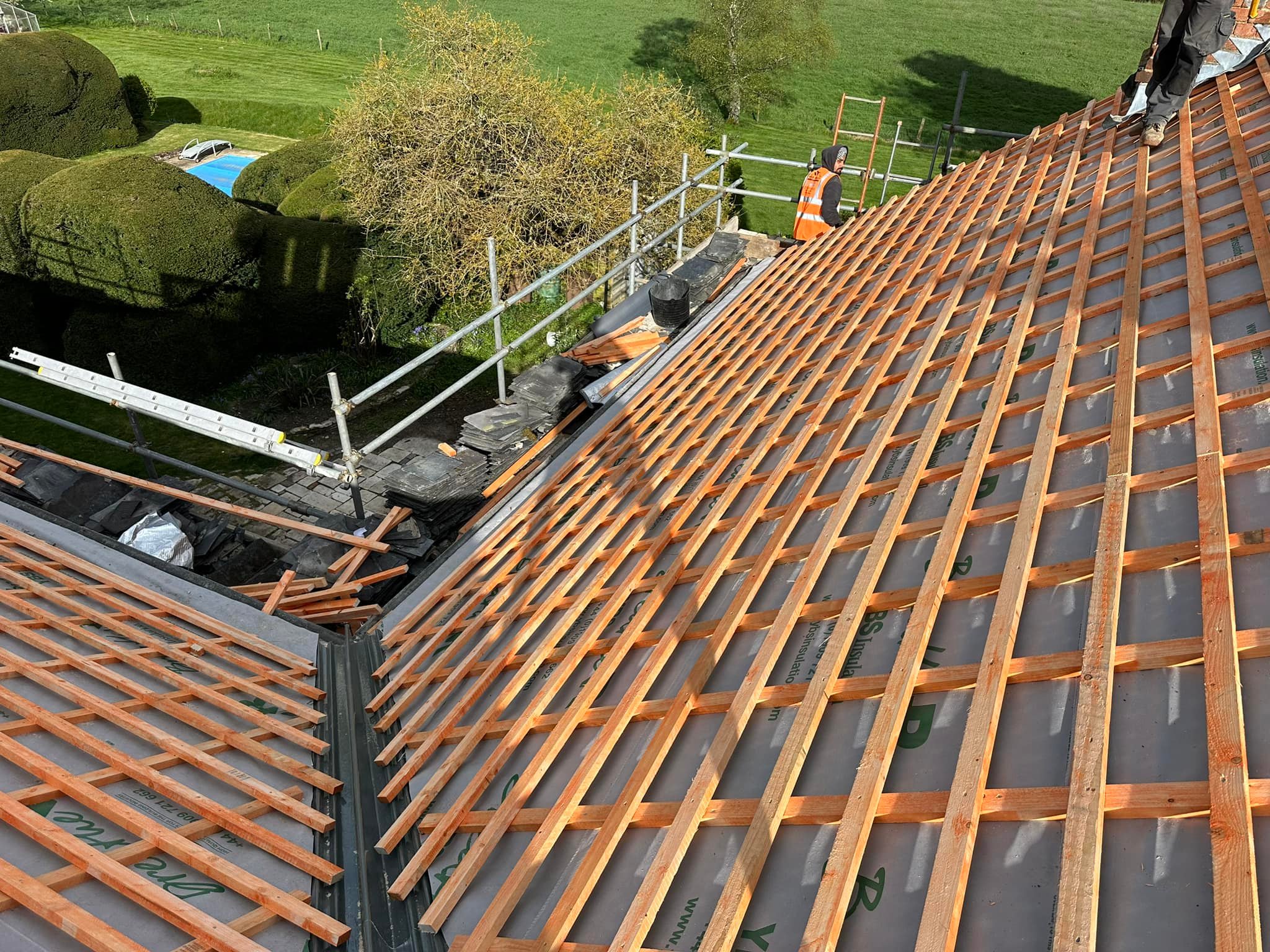 Professional roofers working on a property in London - KS Roof Master