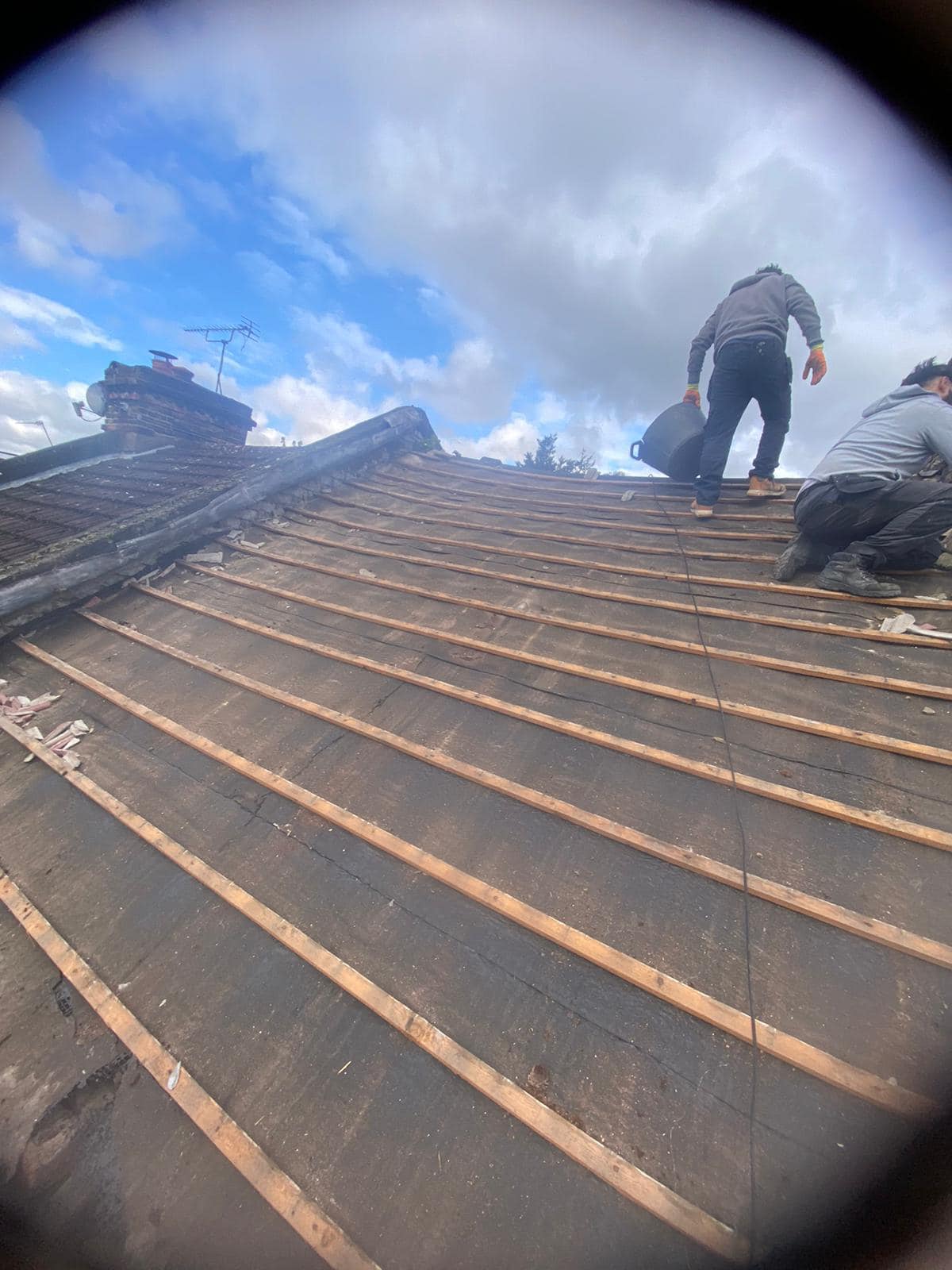 Professional roofers working on a property in London - KS Roof Master