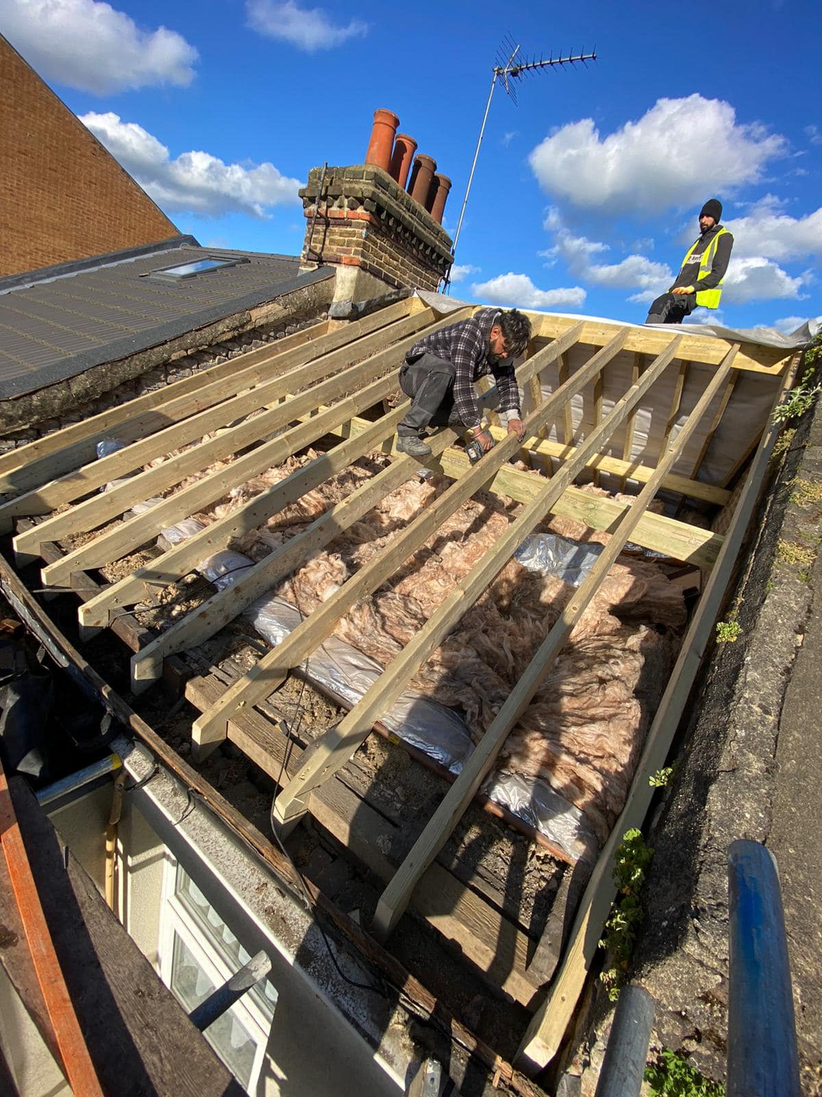 Professional roofers working on a property in London - KS Roof Master
