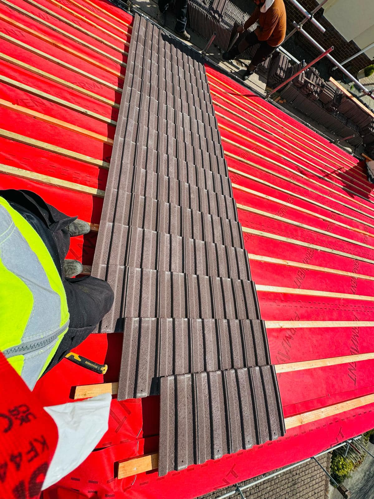 Professional roofers working on a property in London - KS Roof Master