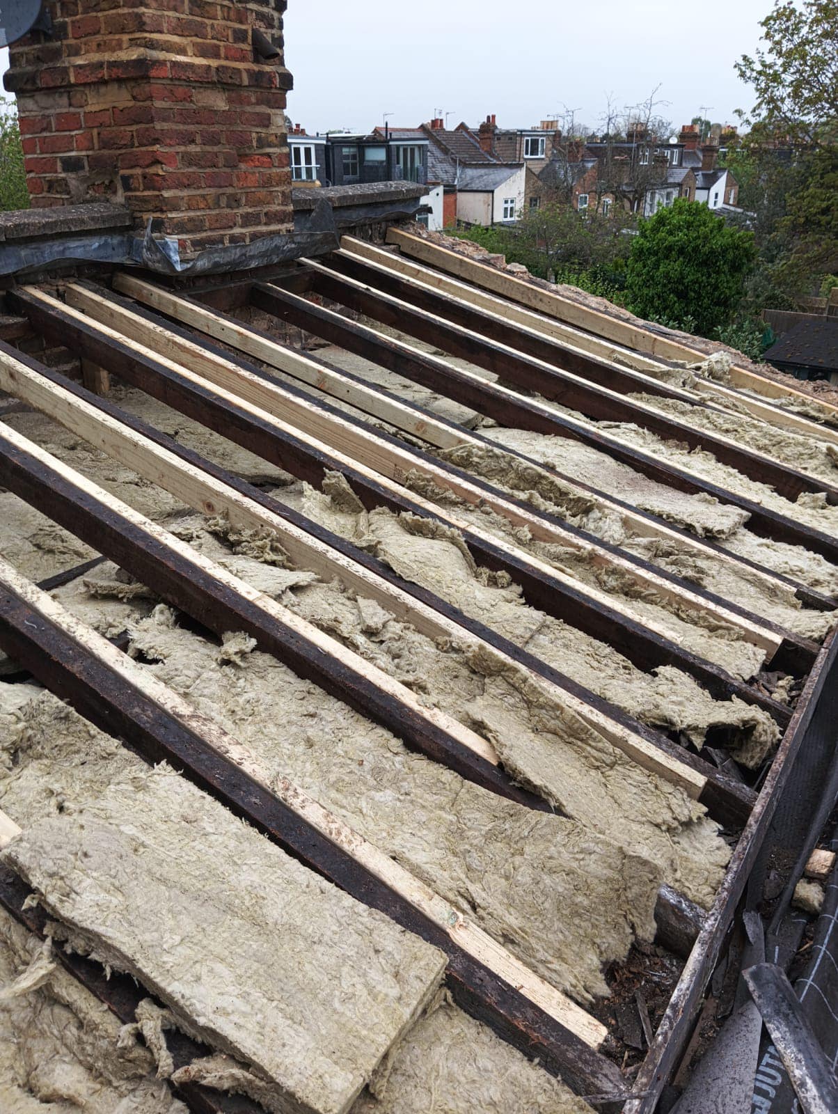 Professional roofers working on a property in London - KS Roof Master