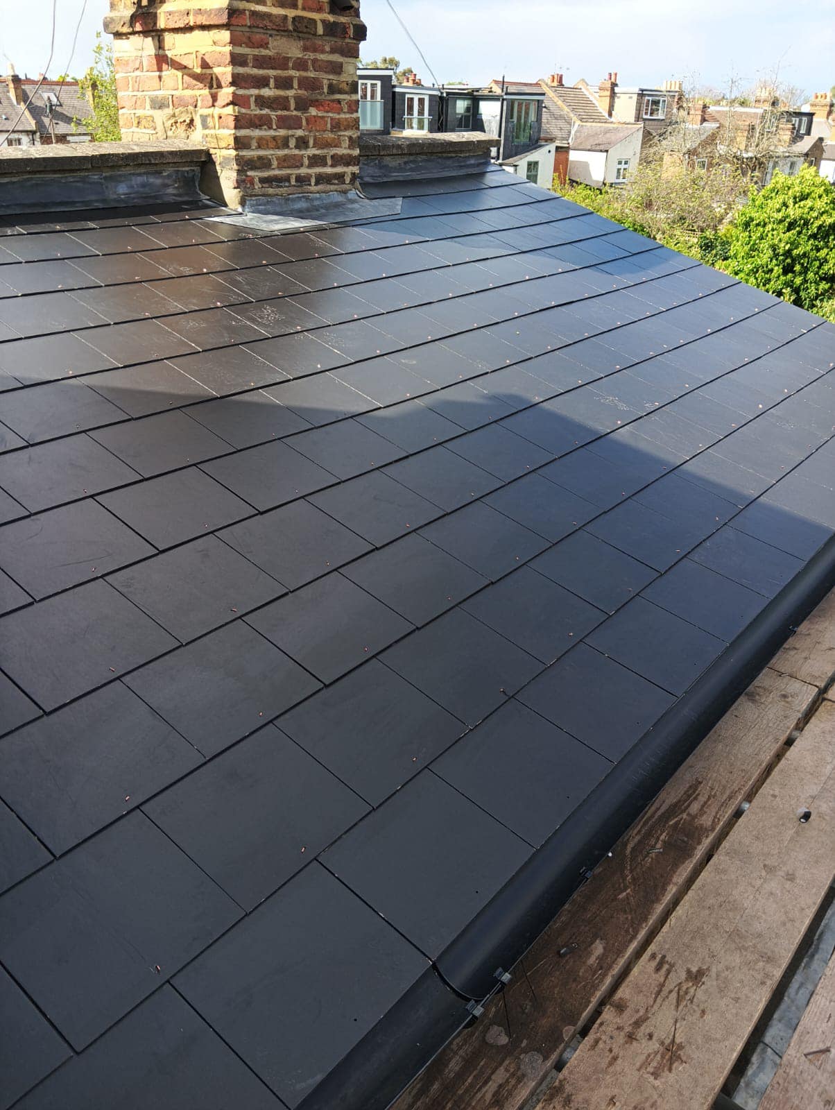 Professional roofers working on a property in London - KS Roof Master
