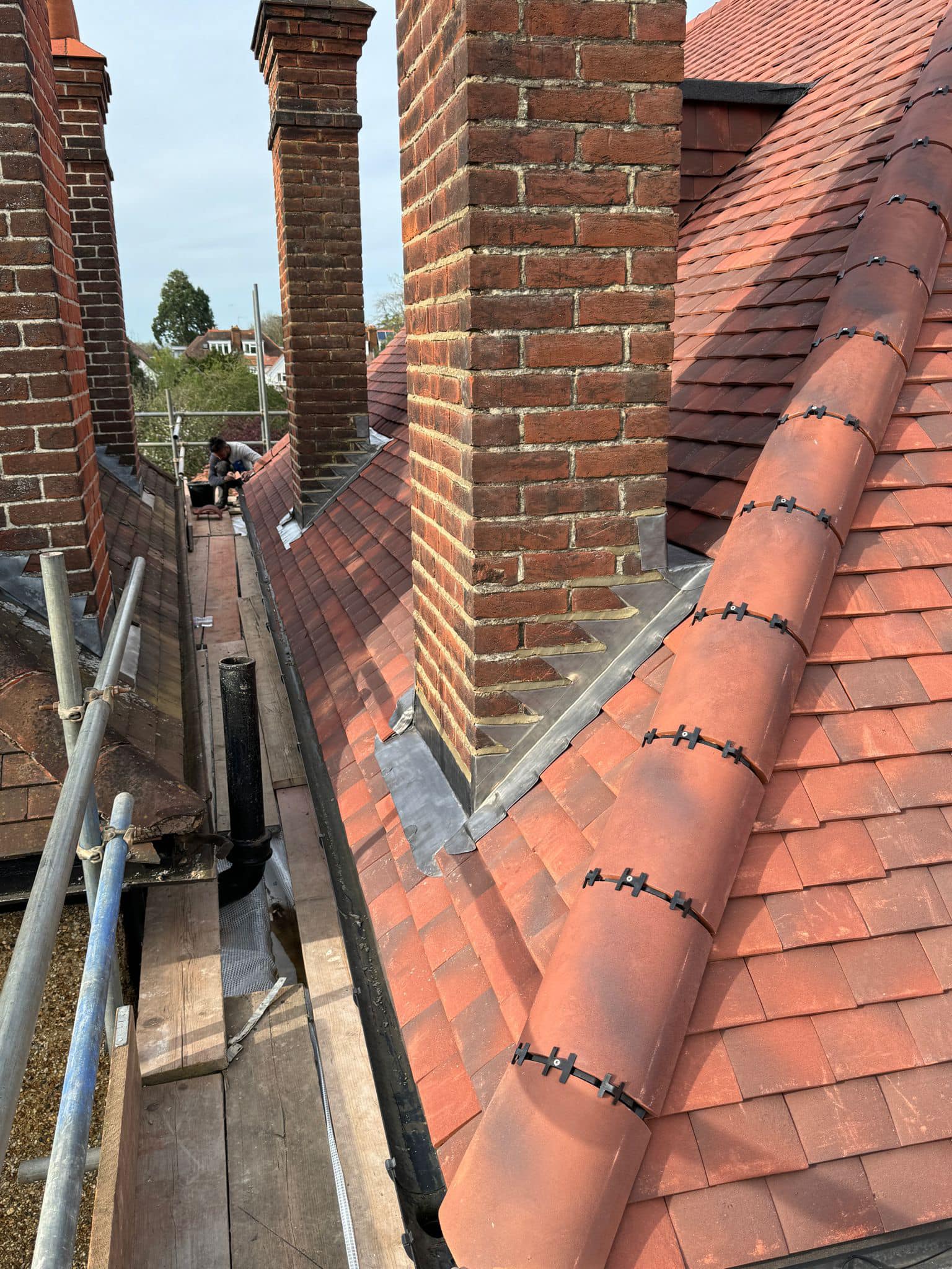 Professional roofers working on a property in London - KS Roof Master